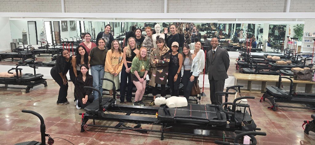 Group CPR class with students and training manikins